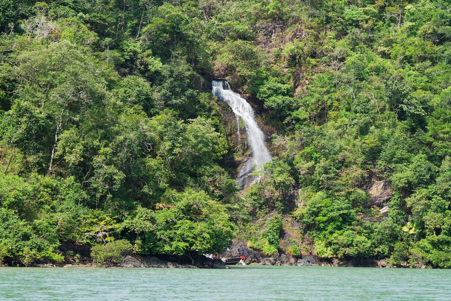 waterfall over ocean water