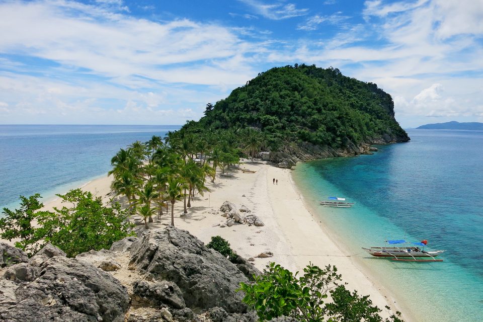 An island surrounded by beach and sea