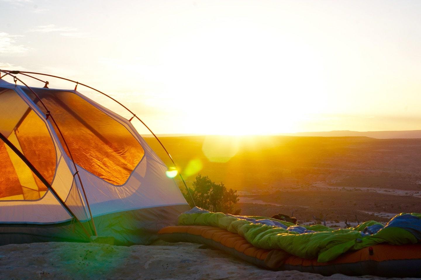 campsite with sun in the background