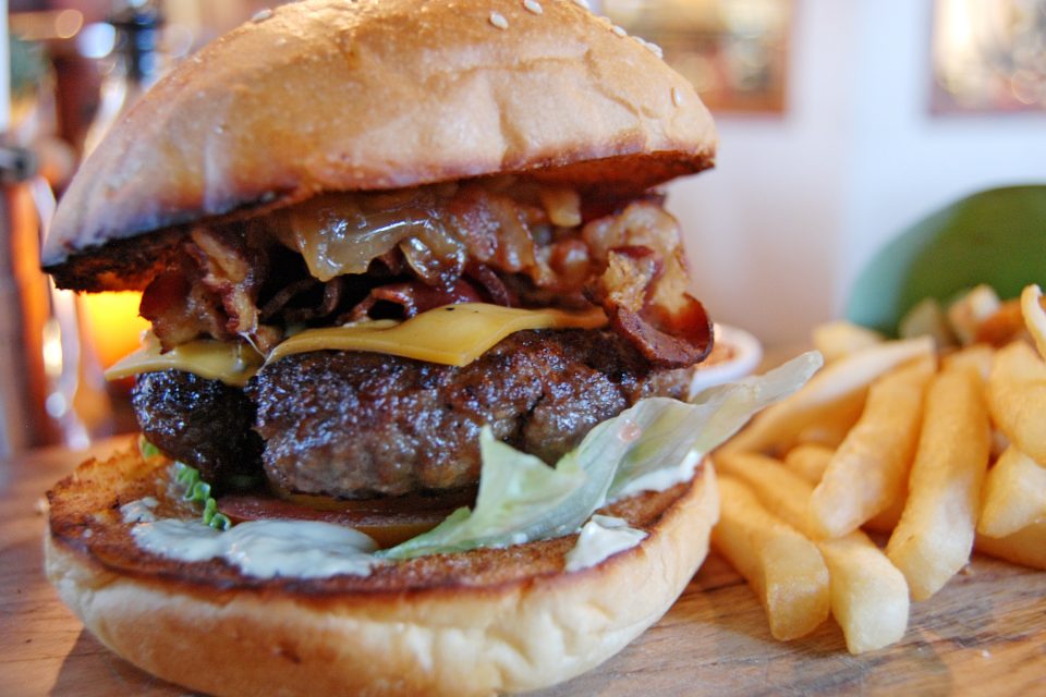 Close up of a burger and chips Close up of a burger and chips