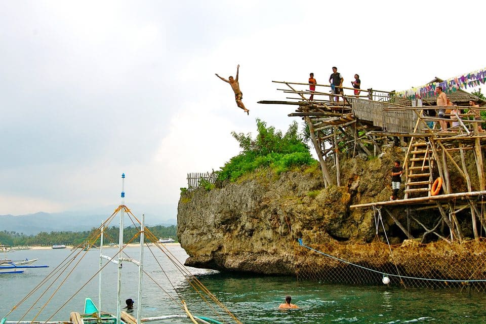 A man cliff jumping