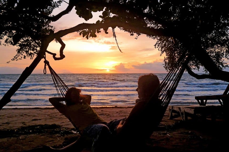 A couple in a hammock at sunset